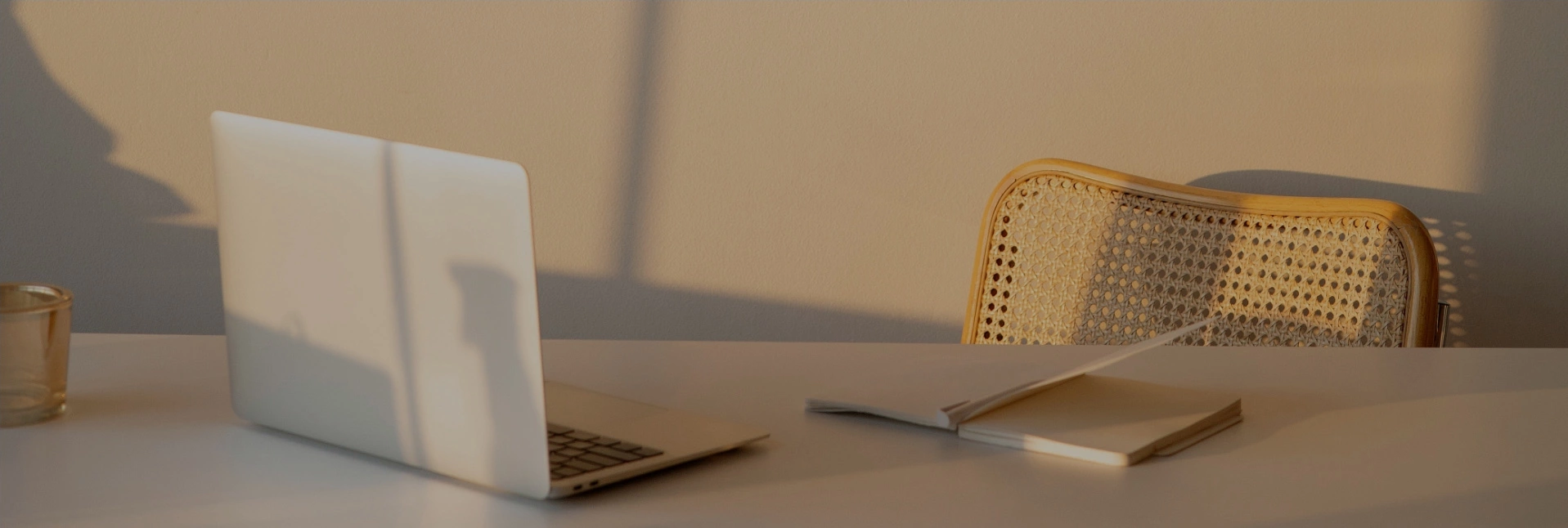 laptop and notebook on desk