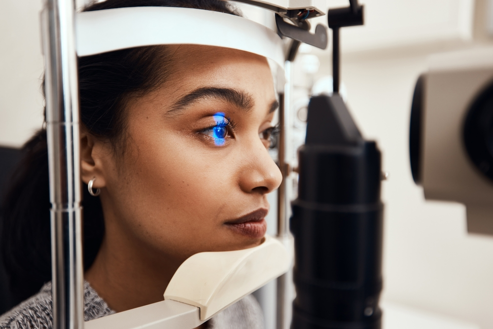 woman getting slit lamp eye exam